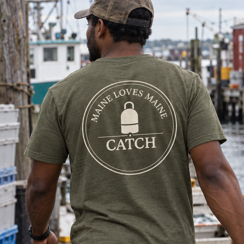 Maine Loves Maine Catch Tee in Military Green, male back lifestyle at a Maine working waterfront