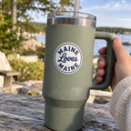 Little Sticker, Big Pride navy circle logo sticker on a sage handled insulated tumbler