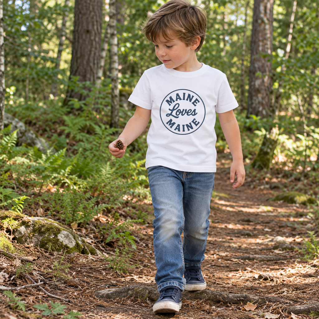 Child wearing the Signal Tee kids white tee with navy Maine Loves Maine logo