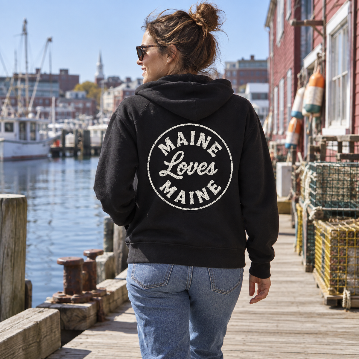 The Campfire Zip Hoodie in black with vintage white MLM monogram, women’s lifestyle photo
