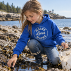 The Dockside Hoodie for kids in Royal with Vintage White distressed Maine Loves Maine circle logo, approved candid lifestyle image